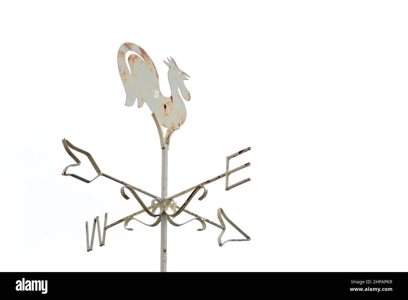 White rooster weather vane show the wind direction on white sky