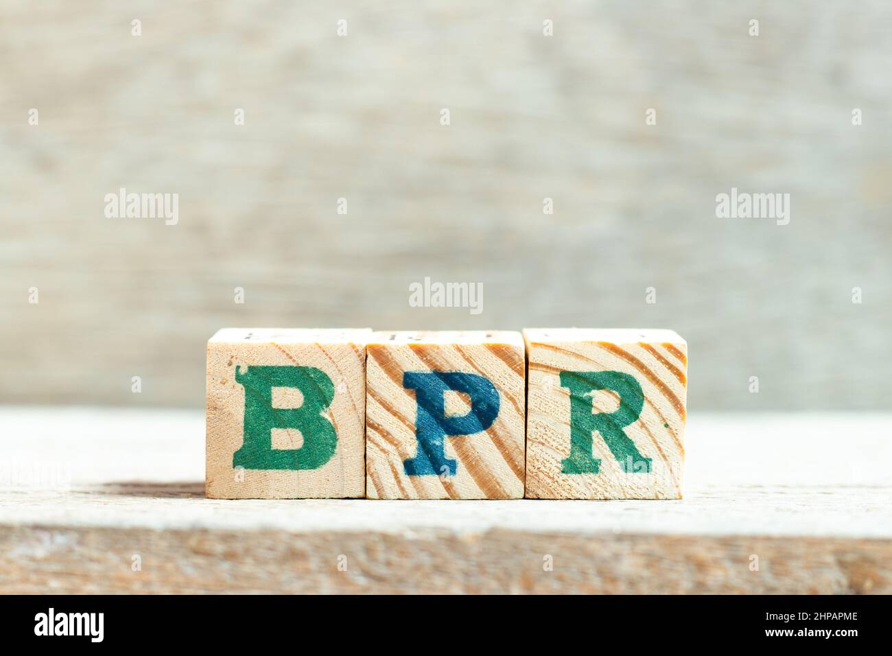 Alphabet letter block in word BPR (Abbreviation of Business Process Reengineering or Batch processing record) on wood background Stock Photo