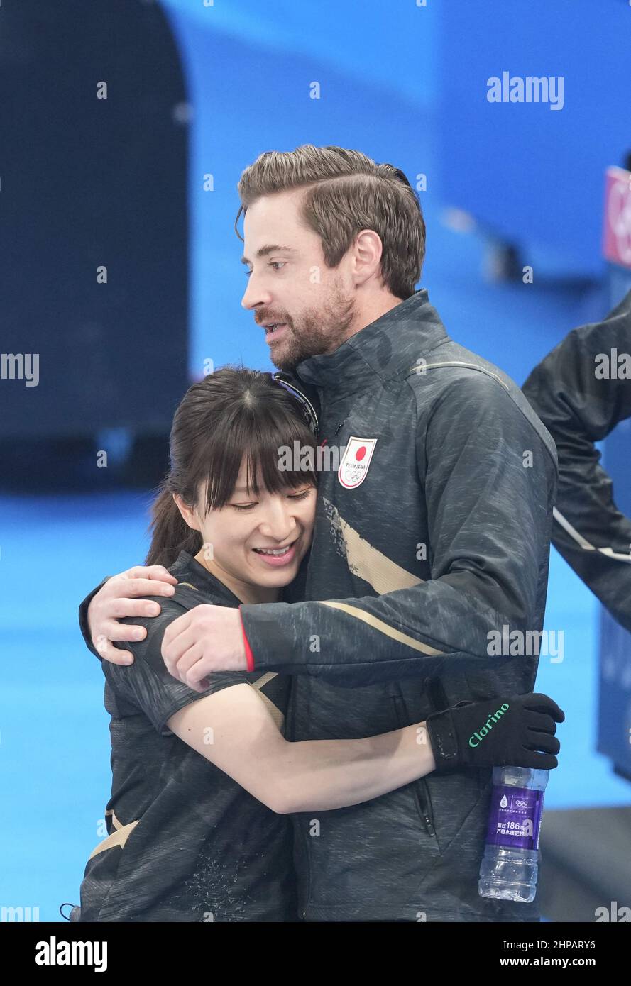 Beijing, China. 20th Feb, 2022. Suzuki Yumi (L) of Japan hugs with coach  J.D. Lind after the curling women's gold medal game of Beijing 2022 Winter  Olympics between Japan and Great Britain