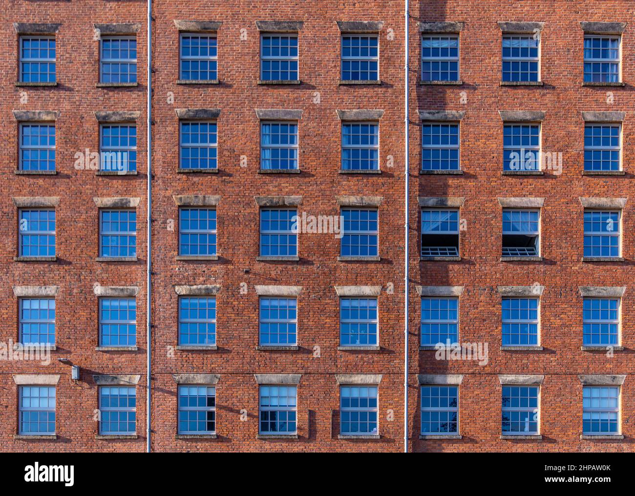The windows on the facade of a former mill on Redhill Street, Ancotes, Manchester, England, UK Stock Photo