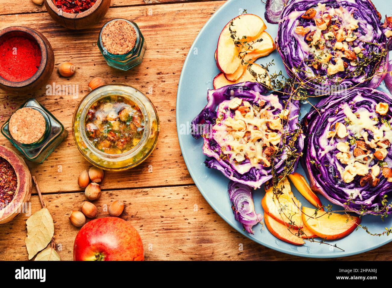 Vegan dish of baked red cabbage, apples and nuts. Healthy appetizer