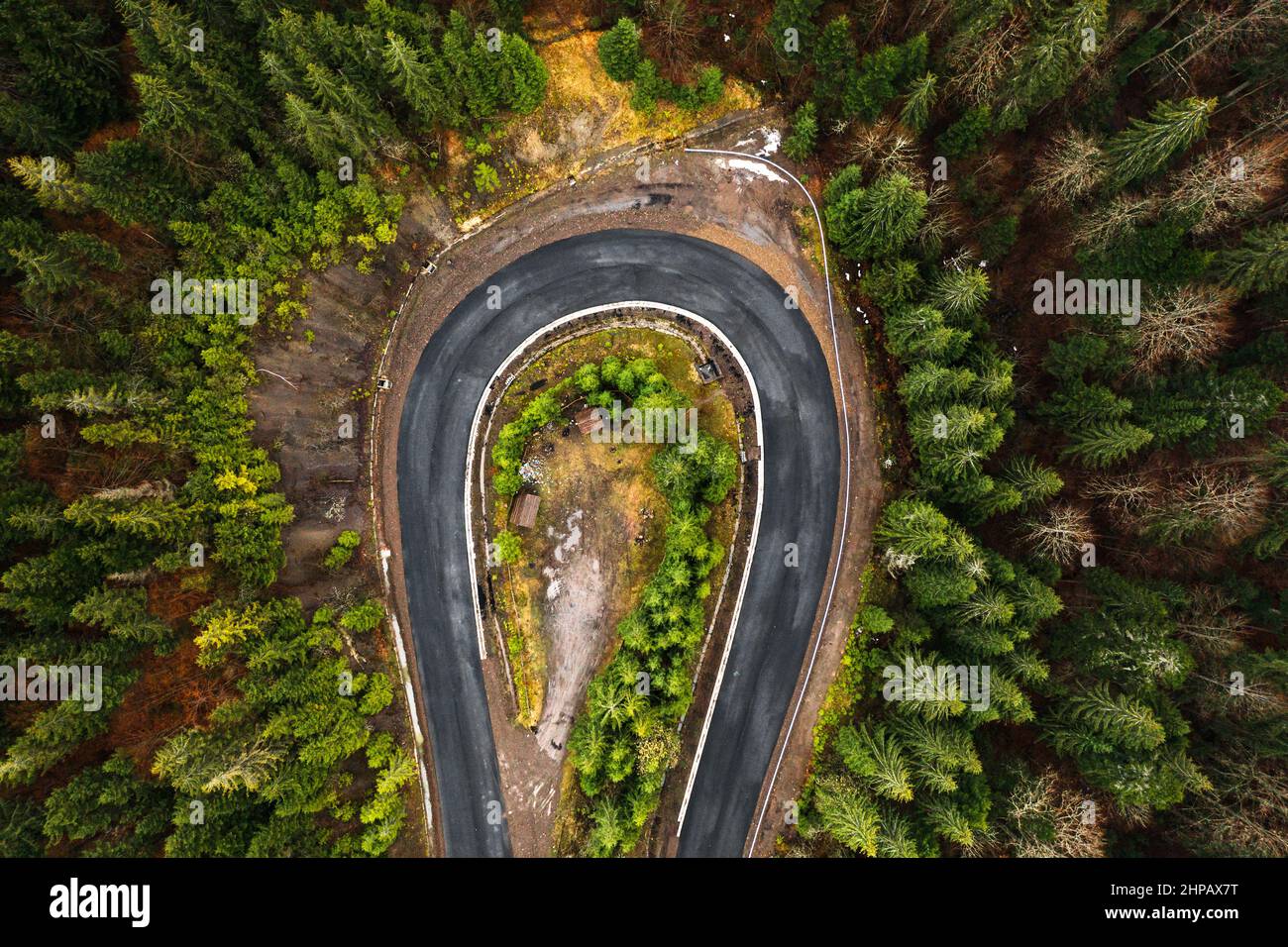 Picturesque mountains and serpentine roads, forest and road, steep