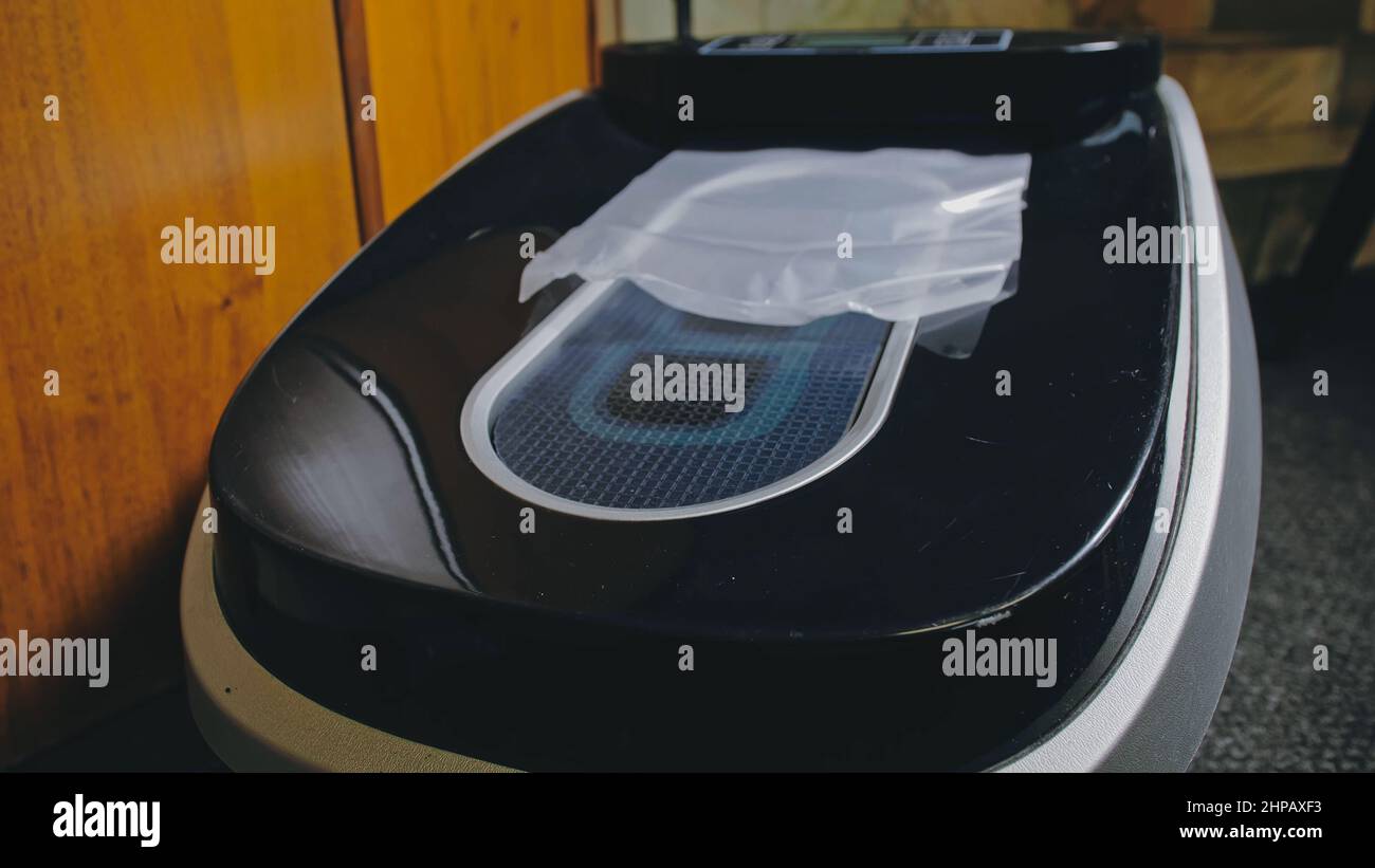 Automatic Thermal Shrinkable Shoe Cover Laminating Machine. Close up