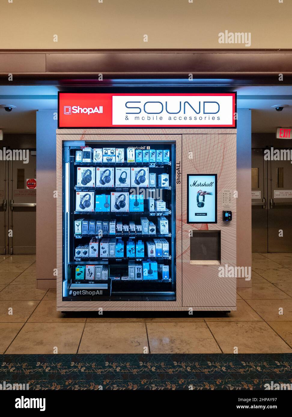 Orlando, Florida - February 9, 2022: Full View of ShopAll Express Vending Machine inside Orlando International Airport (MCO) that Sells a Range of Sou Stock Photo