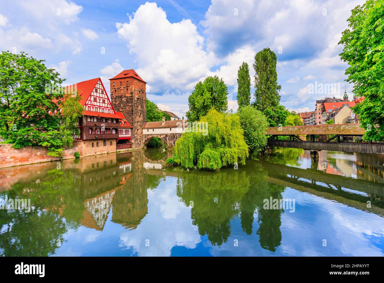 Nuremberg, Germany. The Wine Warehouse (Weinstadel) and Hangman's Bridge (Henkersteg) at night. Stock Photo