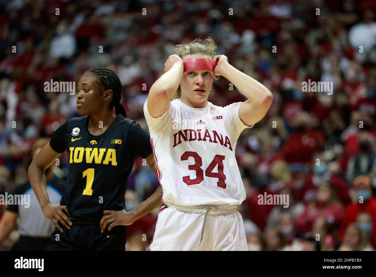 Bloomington, United States. 19th Feb, 2022. Indiana Hoosiers guard Grace Berger (34) adjusts her headband while playing Iowa during an NCAA women's basketball game in Bloomington, Ind. The Iowa Hawkeyes beat the Indiana University Hoosiers 96-91. Credit: SOPA Images Limited/Alamy Live News Stock Photo