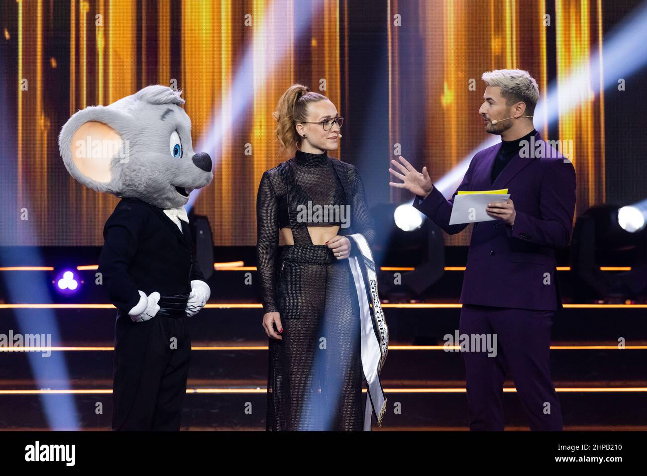 Rust, Germany. 19th Feb, 2022. Ed Euromaus, mascot of Europa-Park, Anja Kallenbach, Miss Germany 2021, and presenter Nicolas Puschmann are on stage during the Miss Germany contest at Europa-Park. The candidates compete for the title 'Miss Germany' in the final at Europa-Park. Credit: Philipp von Ditfurth/dpa/Alamy Live News Stock Photo