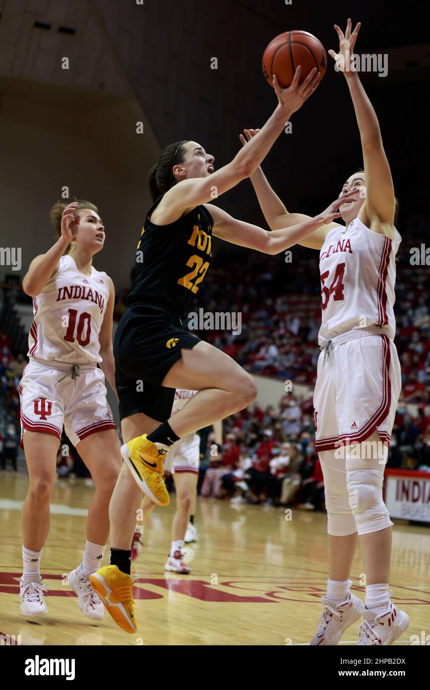 Bloomington, United States. 19th Feb, 2022. Indiana Hoosiers forward Mackenzie Holmes (54) plays defense against Iowa Hawkeyes guard Caitlin Clark (22) during an NCAA women's basketball game in Bloomington, Ind. The Iowa Hawkeyes beat the Indiana University Hoosiers 96-91. (Photo by Jeremy Hogan/SOPA Images/Sipa USA) Credit: Sipa USA/Alamy Live News Stock Photo