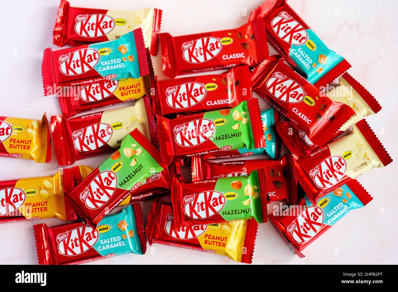 Variety of colourful German "KitKat" chocolates (classic, white, hazelnut, salted caramel, and