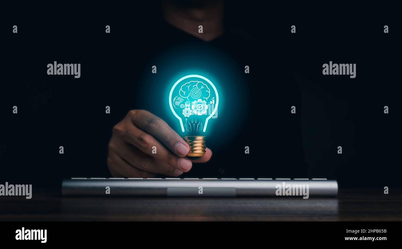 Creative idea management, solution, innovation, knowledge technology, and inspiration concept. The human brain, gears, target icon glowing inside digi Stock Photo