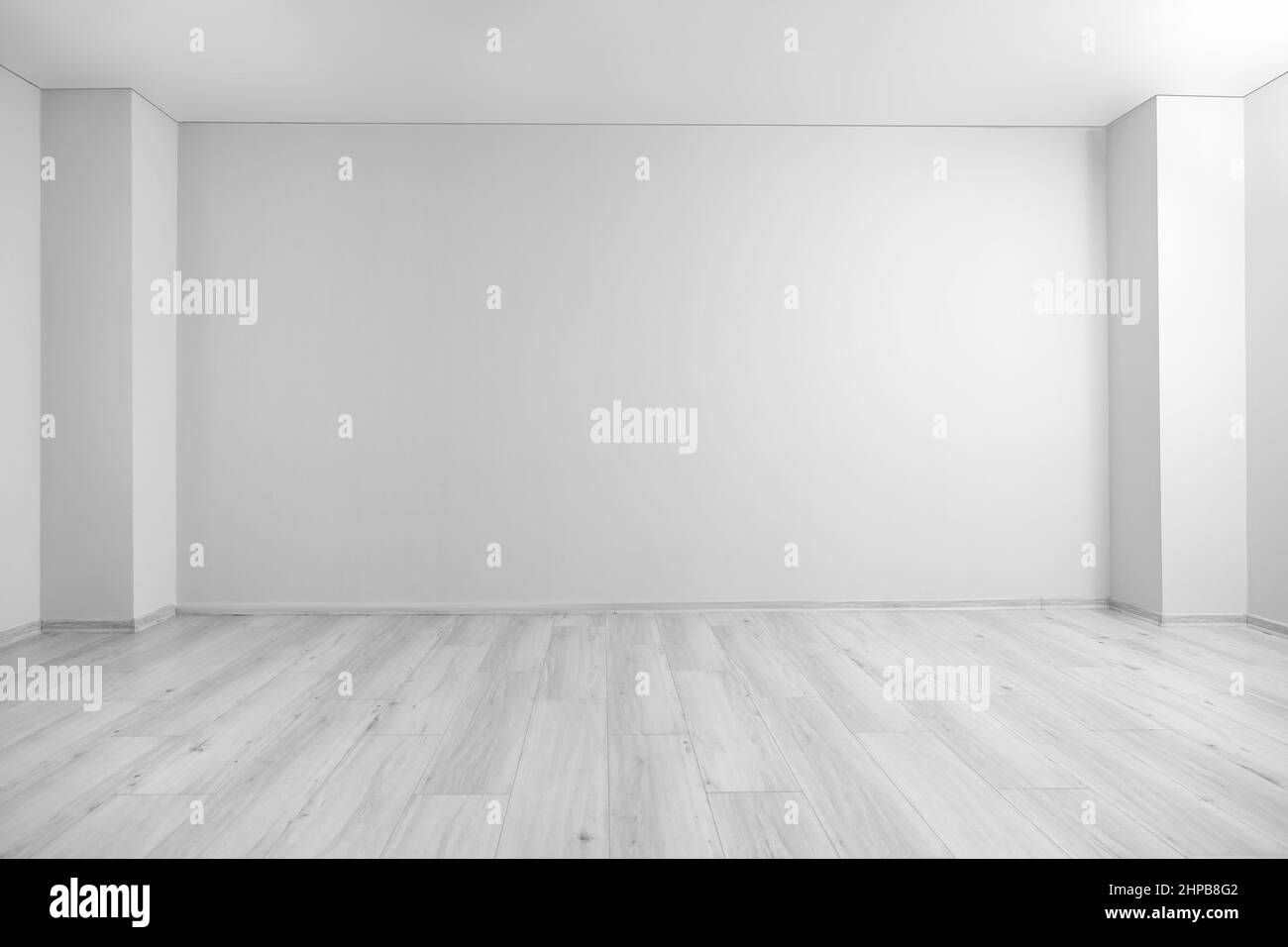 View of light wall in big empty room Stock Photo