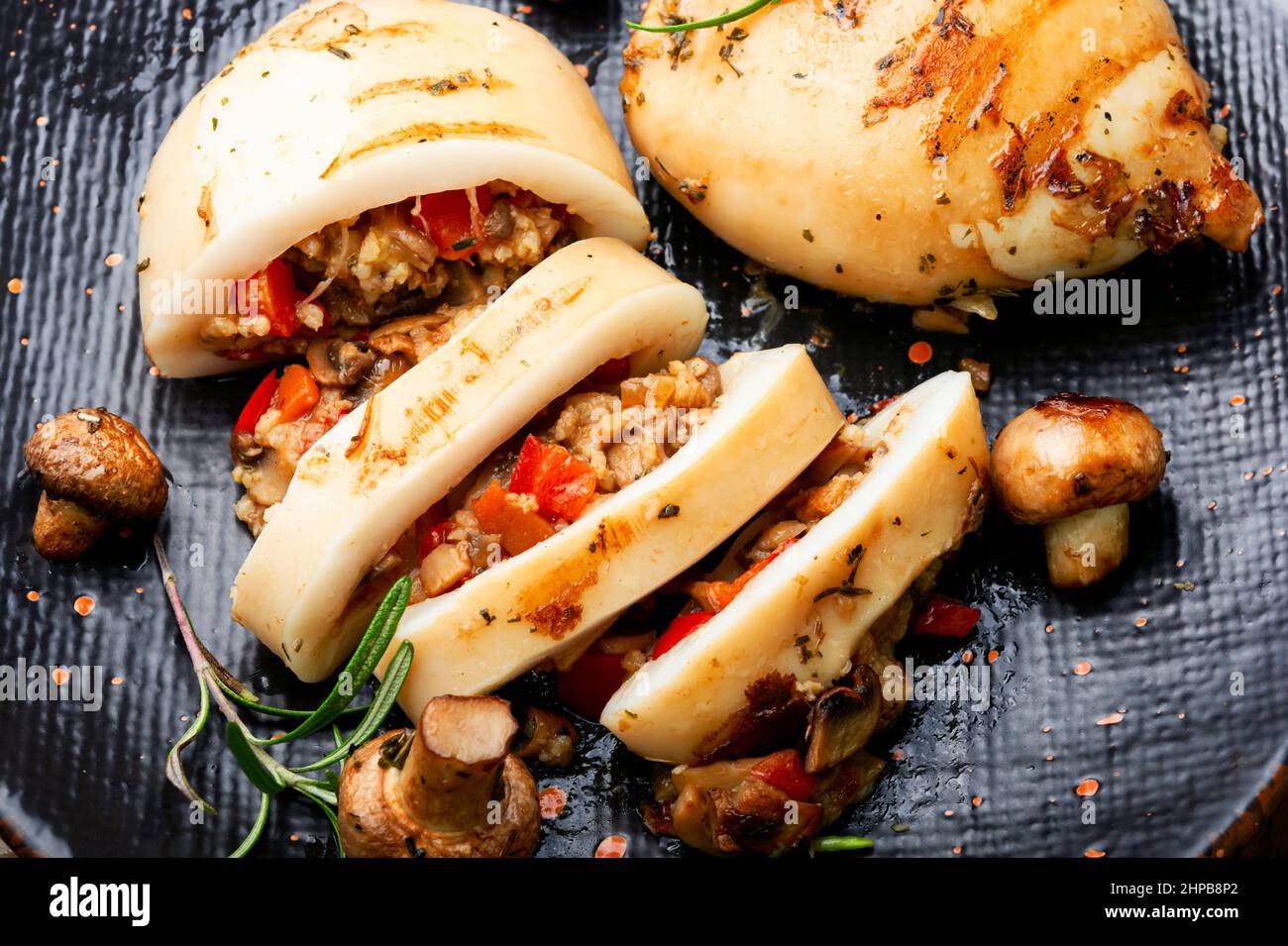 Fried squid with mushrooms and sweet peppers. Close up Stock Photo Alamy