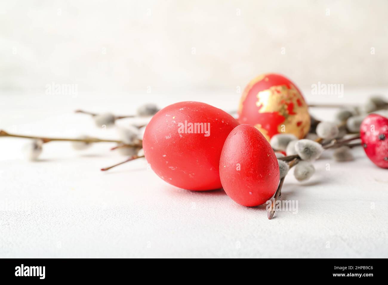 Painted Easter eggs and pussy willow branches on light background Stock ...