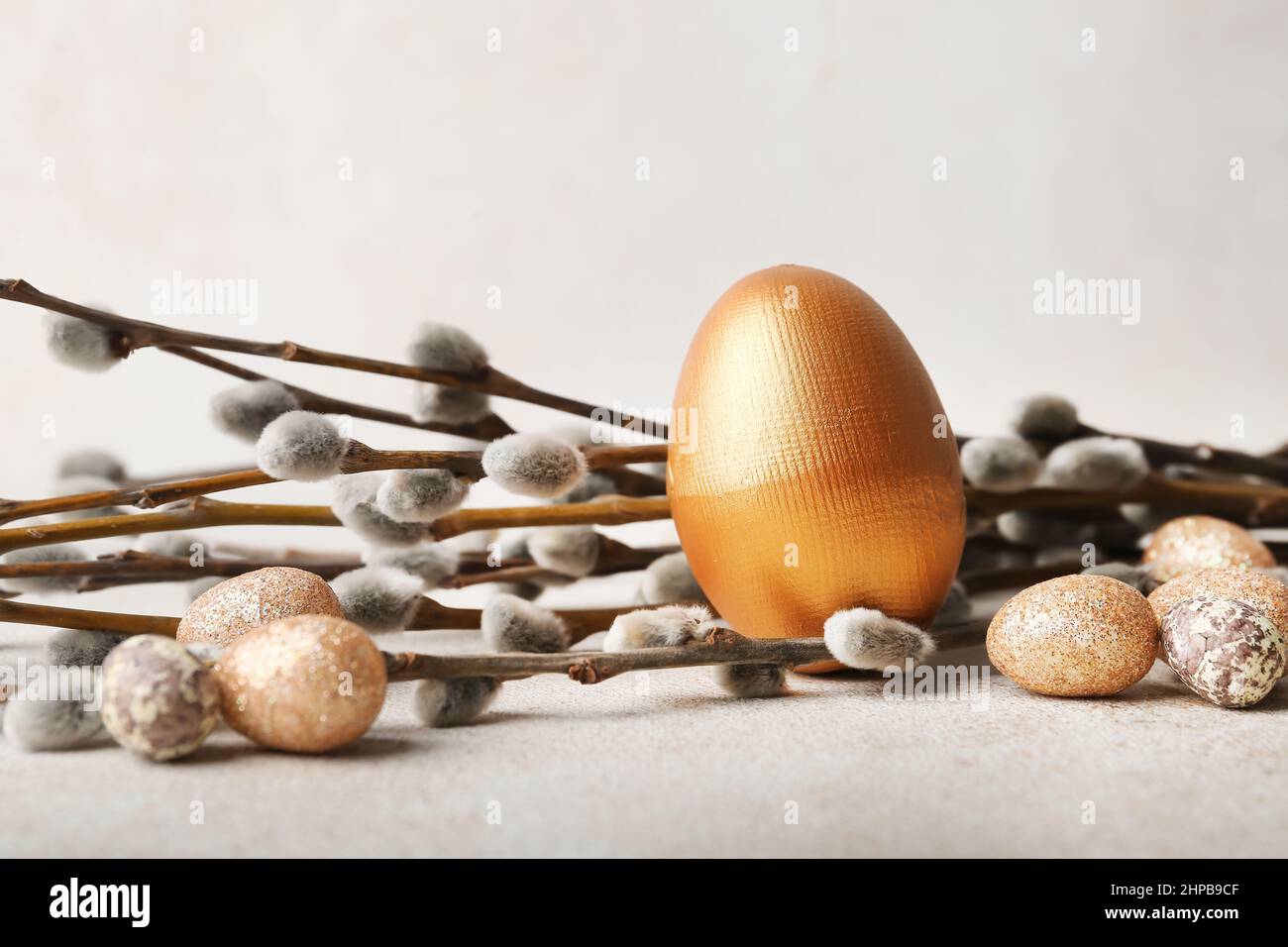 Painted Easter eggs and pussy willow branches on light background Stock ...