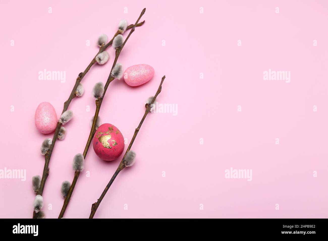 Painted Easter eggs and pussy willow branches on pink background Stock ...