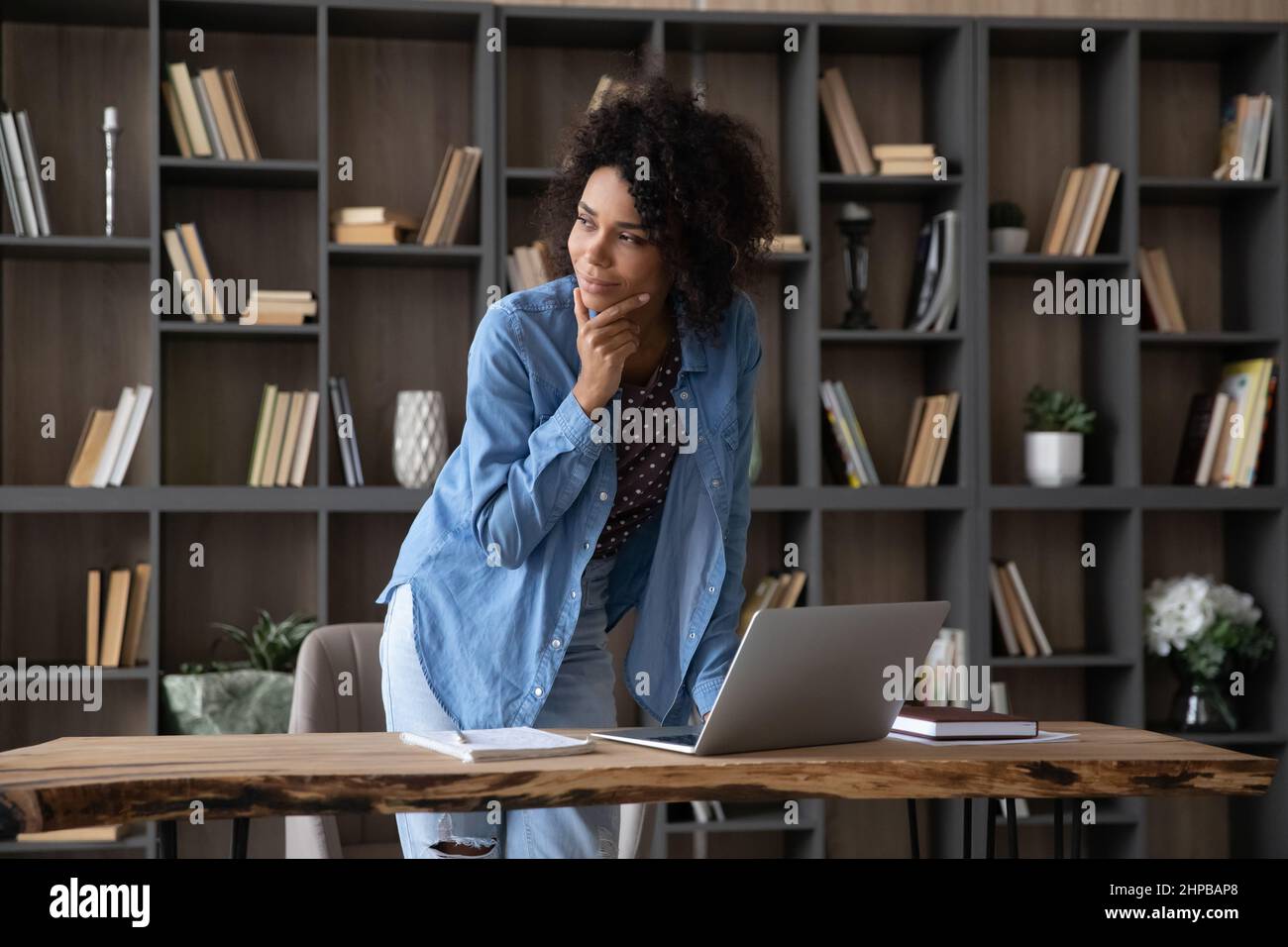 Thoughtful young African American businesswoman working on computer. Stock Photo