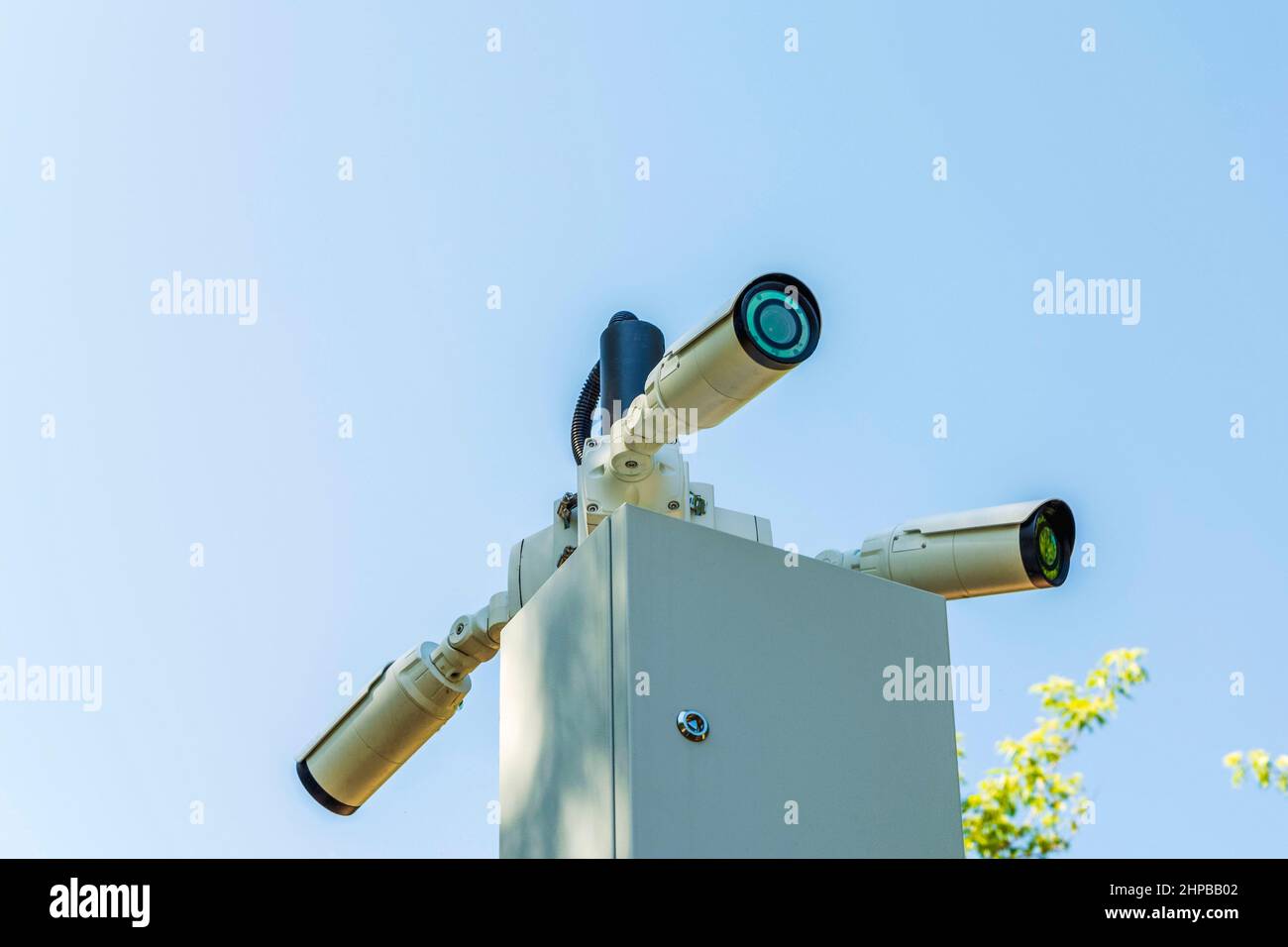 Security cameras and a WiFi station installed on a pole in a public