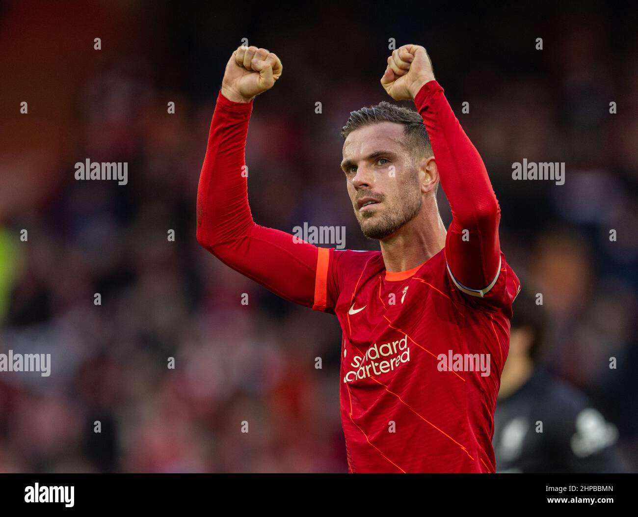 (220220) -- LIVERPOOL, Feb. 20, 2022 (Xinhua) -- Liverpool's captain Jordan Henderson celebrates after the English Premier League match between Liverpool and Norwich City at Anfield in Liverpool, Britain, on Feb. 19, 2022. (Xinhua) FOR EDITORIAL USE ONLY. NOT FOR SALE FOR MARKETING OR ADVERTISING CAMPAIGNS. NO USE WITH UNAUTHORIZED AUDIO, VIDEO, DATA, FIXTURE LISTS, CLUB/LEAGUE LOGOS OR 'LIVE' SERVICES. ONLINE IN-MATCH USE LIMITED TO 45 IMAGES, NO VIDEO EMULATION. NO USE IN BETTING, GAMES OR SINGLE CLUB/LEAGUE/PLAYER PUBLICATIONS. Stock Photo