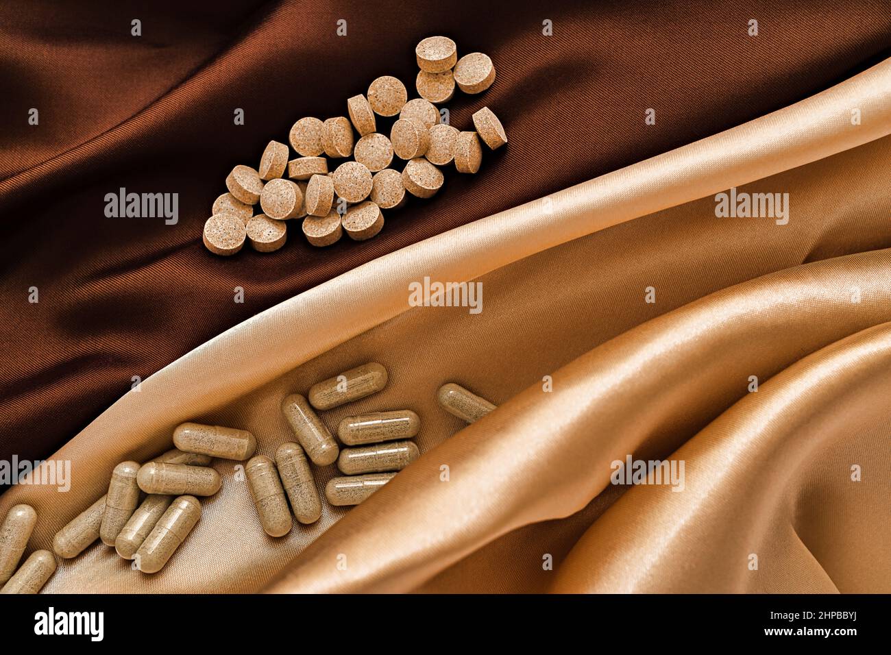 Pills And Capsules On Silk Background Dietary Supplements Close up pills-and-capsules-on-silk-background-dietary-supplements-close-up