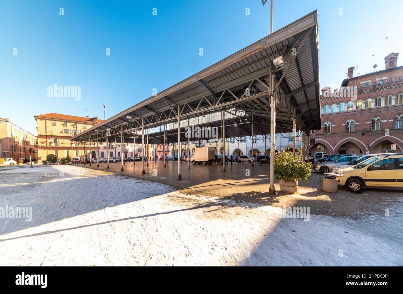 Cuneo, Piedmont, Italy - December 11, 2021: Covered vegetable and fruit market, metal canopy from 1934 (ing Cesare Vinaj) in piazza Vincenzo Virginio, Stock Photo