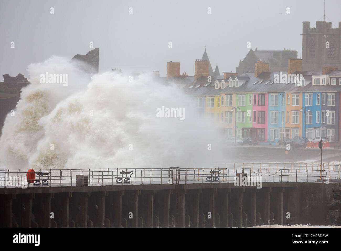 Aberystwyth, Ceredigion, Wales, UK. 20th Feb, 2022. UK Weather: Stormy weather continues along the west coast of Aberystwyth as combining high tide, brings rough seas crashing against the promenade and sea defences. Credit: Ian Jones/Alamy Live News Stock Photo