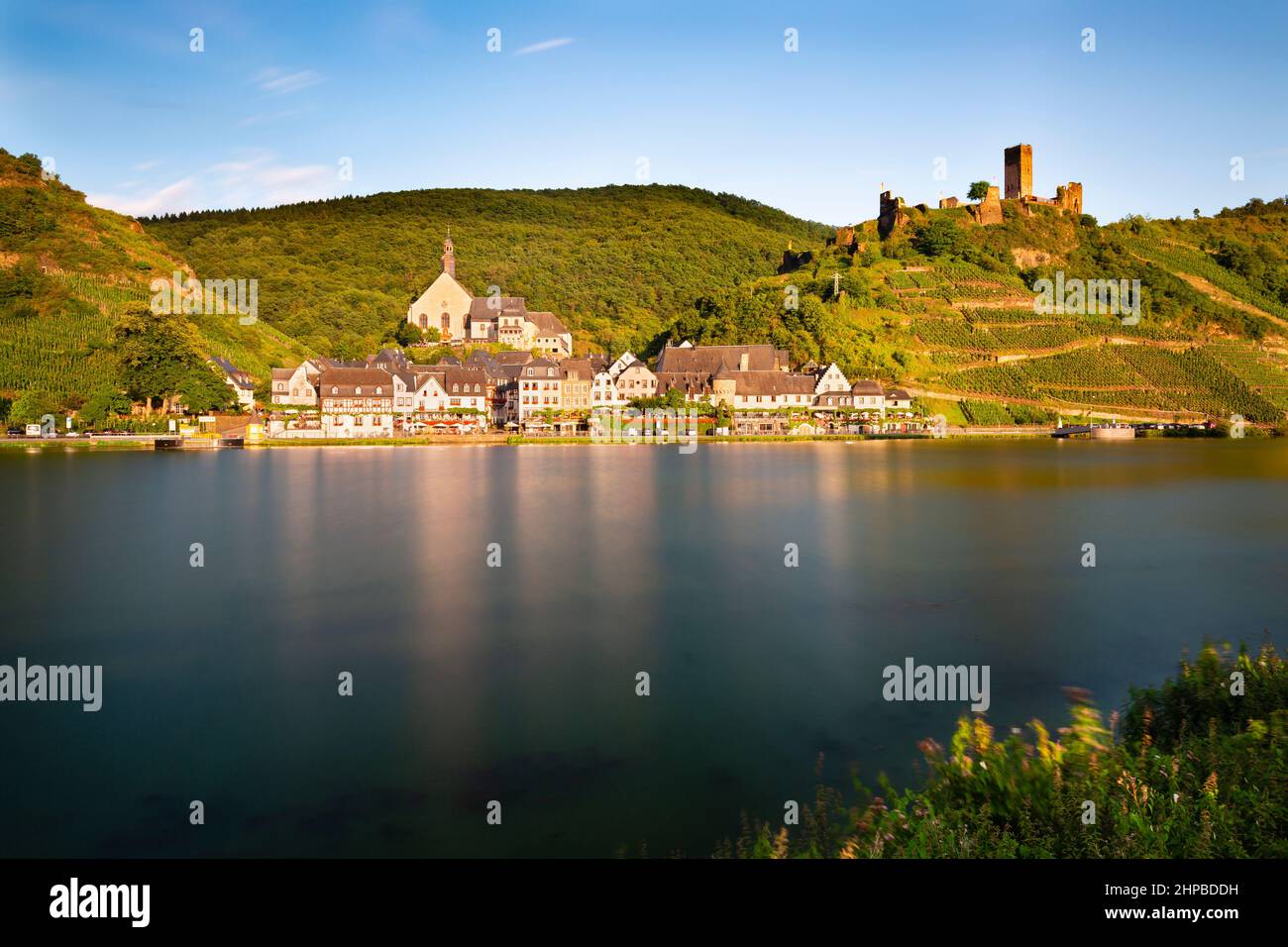 Long exposure summer evening view of the village Beilstein with the castle ruin Metternich in the Moselle Valley, Germany. Stock Photo