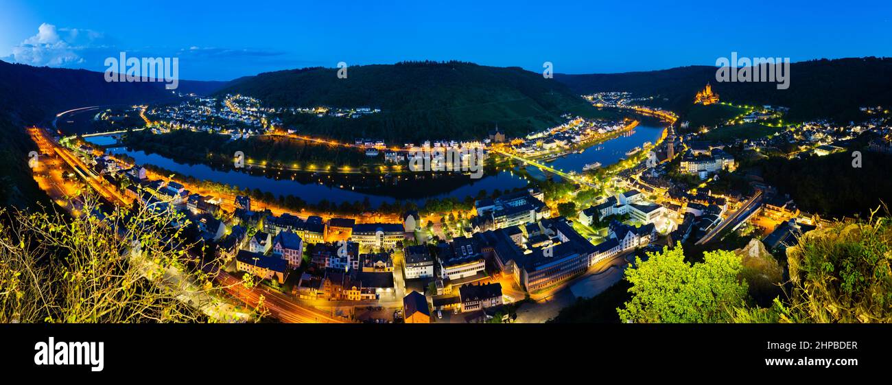 Summer night view panorama from the Pinnerkreuz along the Moselle River Valley and the city of Cochem, Germany. Stock Photo