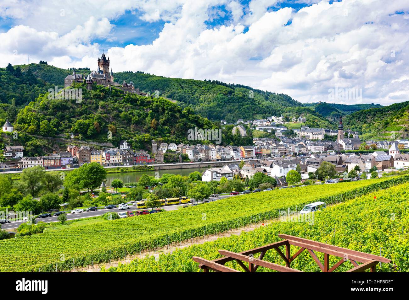 Summer vineyards at Moselle Valley with Cochem, Eifel in Germany in the background and the Reichsburg Cochem to the left. Stock Photo