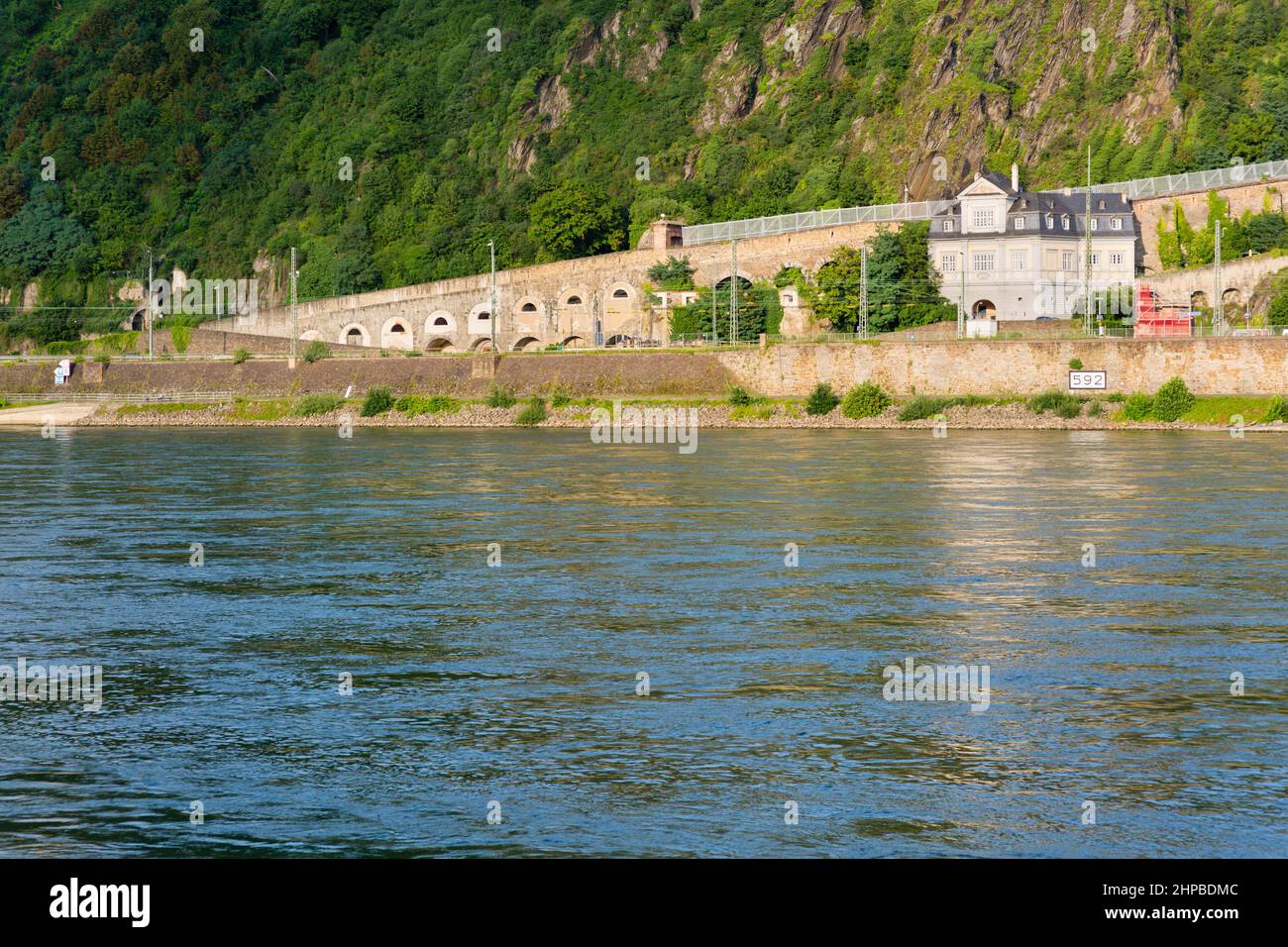 Ehrenbreitstein River Shore and roads behind the Rhine River in Koblenz, Germany in summer. Stock Photo
