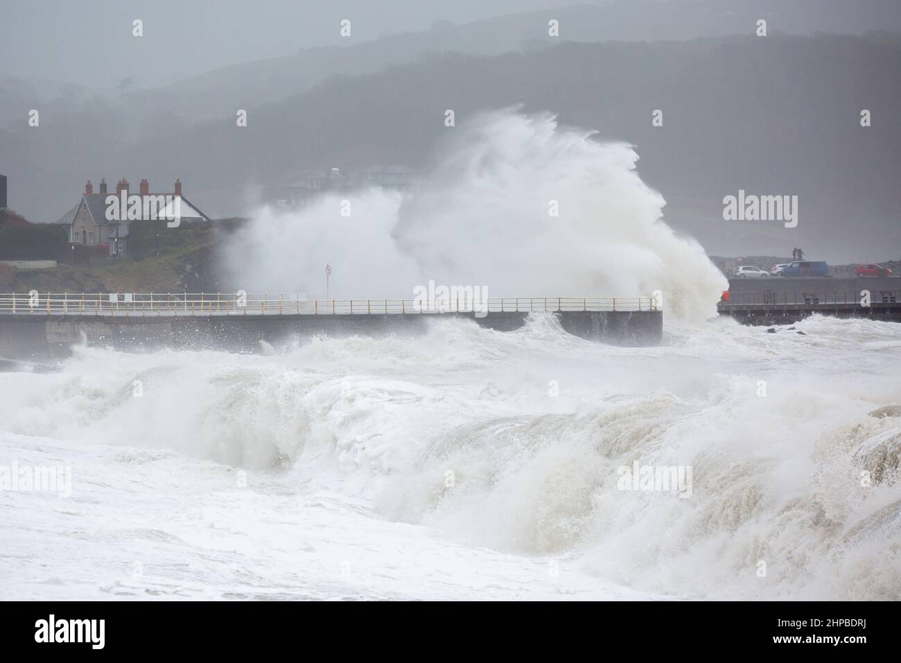 Aberystwyth, Ceredigion, Wales, UK. 20th February 2022  UK Weather: Stormy weather continues along the west coast of Aberystwyth as combining high tide, brings rough seas crashing against the promenade and sea defences. © Ian Jones/Alamy Live News Stock Photo