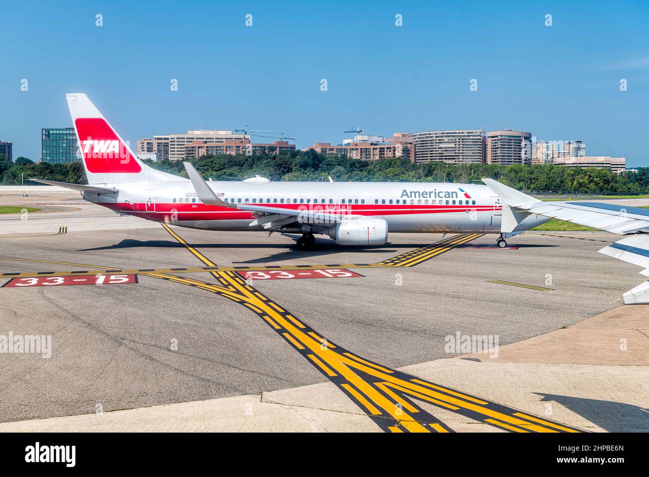 Washington DC, USA - August 25, 2021: Airplane window view of American Airlines in Washington DC Reagan Airport runway gate in Virginia with TWA sign Stock Photo