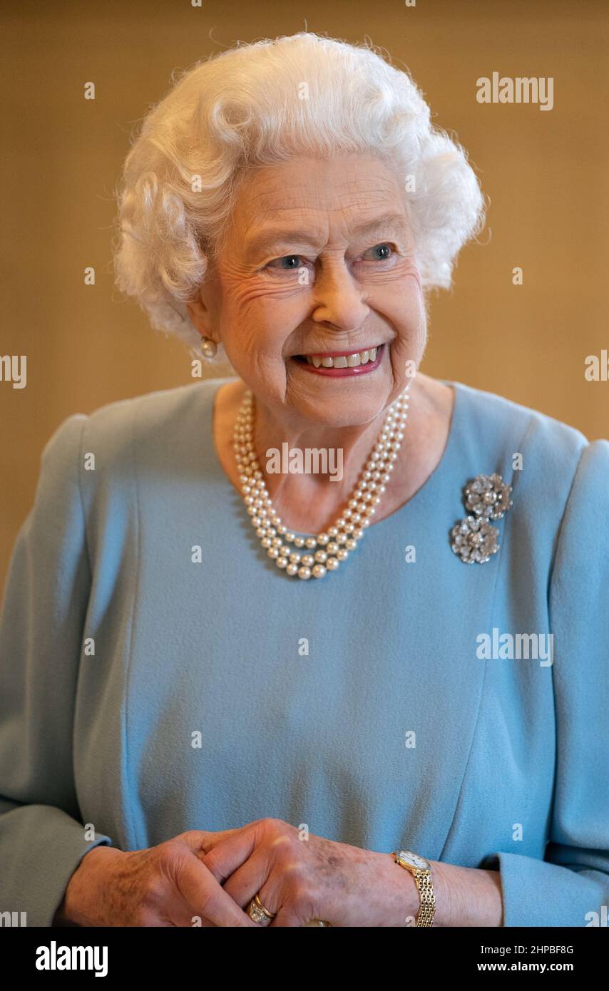 File photo dated 05/02/22 of Queen Elizabeth II during a reception in the Ballroom of Sandringham House, which is the Queen's Norfolk residence, with representatives from local community groups to celebrate the start of the Platinum Jubilee. The Queen has contracted Covid, Buckingham Palace has announced. The monarch, 95, has tested positive for the virus and is experiencing 'mild cold-like symptoms' but expects to carry out 'light duties' this week. Issue date: Sunday February 20, 2022. Stock Photo