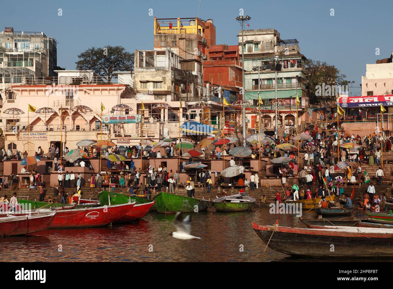 Dashashwamedh Ghat is the holiest place in Varanasi on the River Ganges, shot in  early morning sunlight; in Varanasi, Uttar Pradesh, India Stock Photo