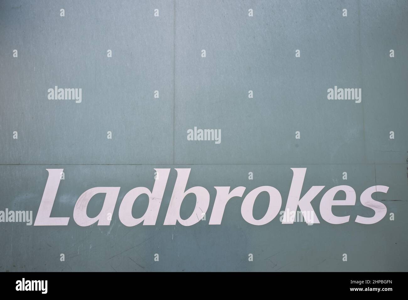 Ladbrokes betting company logo outside one betting shop in London UK Stock Photo