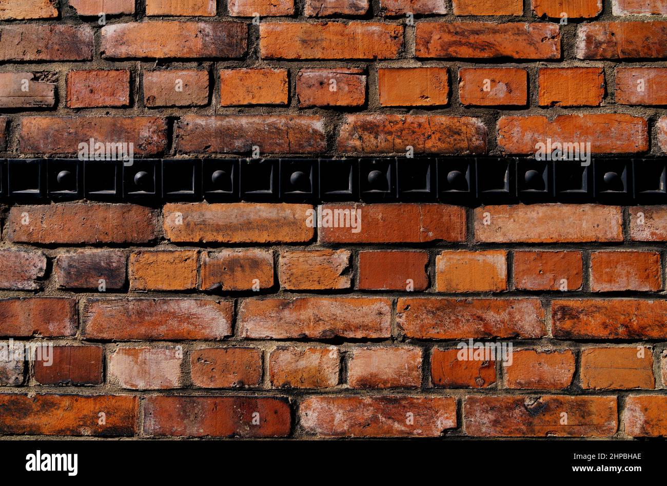Old brick wall with black bordure Stock Photo