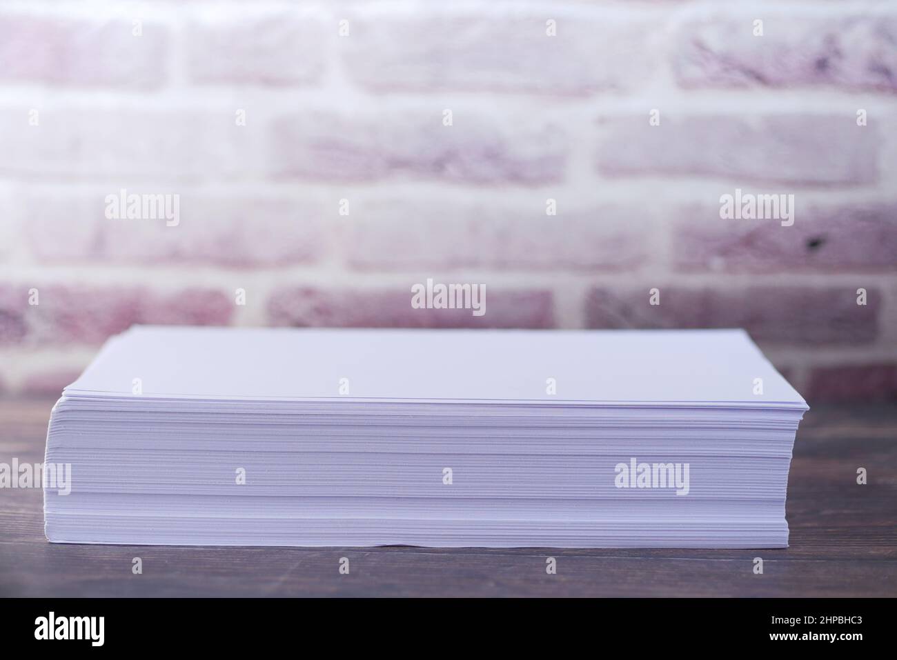 close up of stack of empty paper on table  Stock Photo