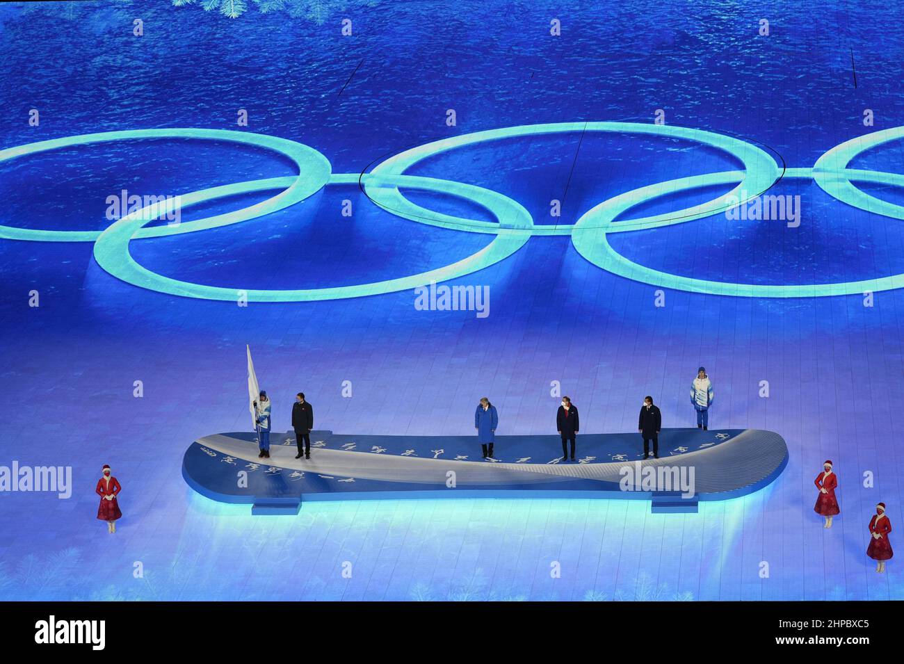 Beijing, China. 20th Feb, 2022. President of the International Olympic Committee Thomas Bach, far left, looks on before handing the Olympic flag to representatives from Italy, right, . who will host the 2026 Winter Olympic Games between two cities, Milan and Cortina, at the Olympic Closing Ceremonies in National Stadium at the Beijing 2022 Winter Olympics on Sunday, February 20, 2022. Photo by Paul Hanna/UPI. Credit: UPI/Alamy Live News Stock Photo
