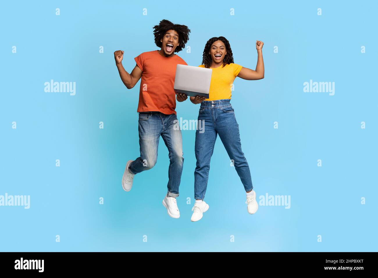 Happy african american couple trading online, using computer Stock ...