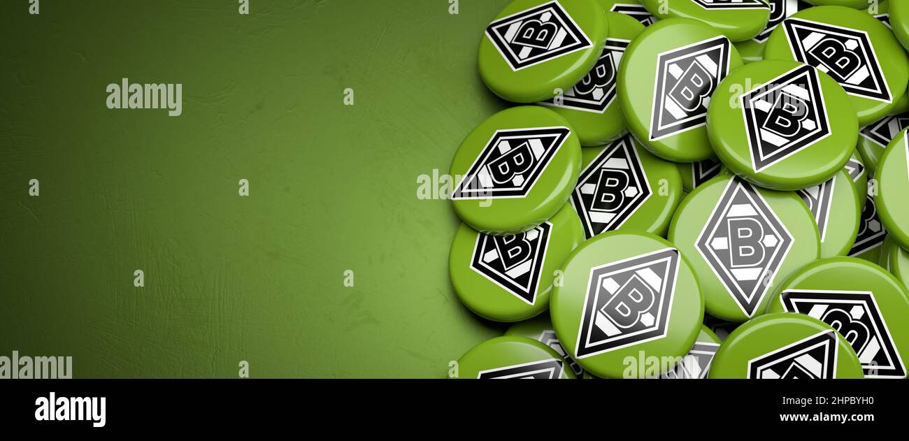Logos of the German Soccer Club Borussia Mönchengladbach on a heap on a table. Copy space. Web banner format Stock Photo