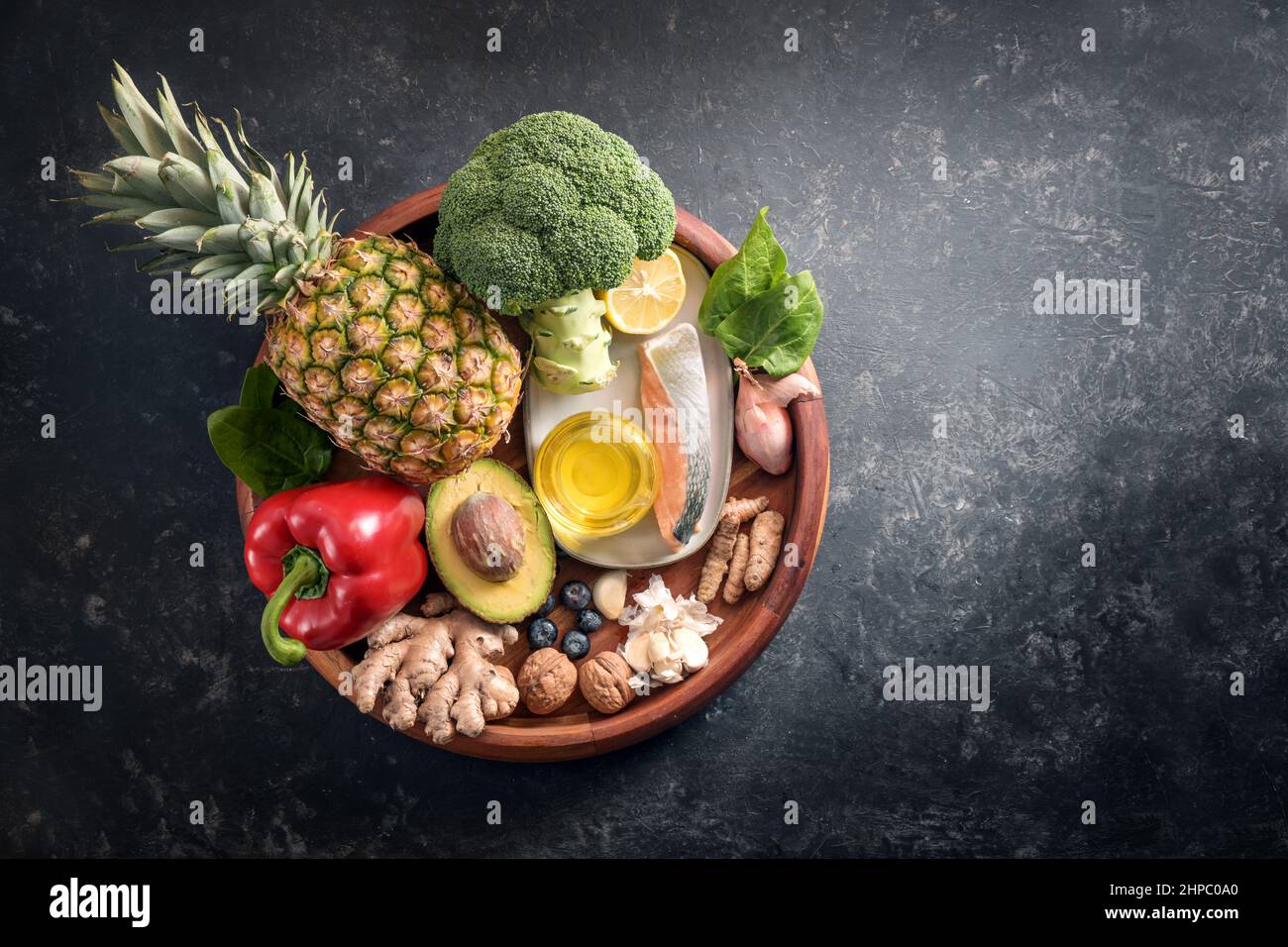 Collection of healthy food with anti-inflammatory and antioxidant on a wooden plate, immune system diet with fiber, vitamin, omega-3 and minerals, dar Stock Photo