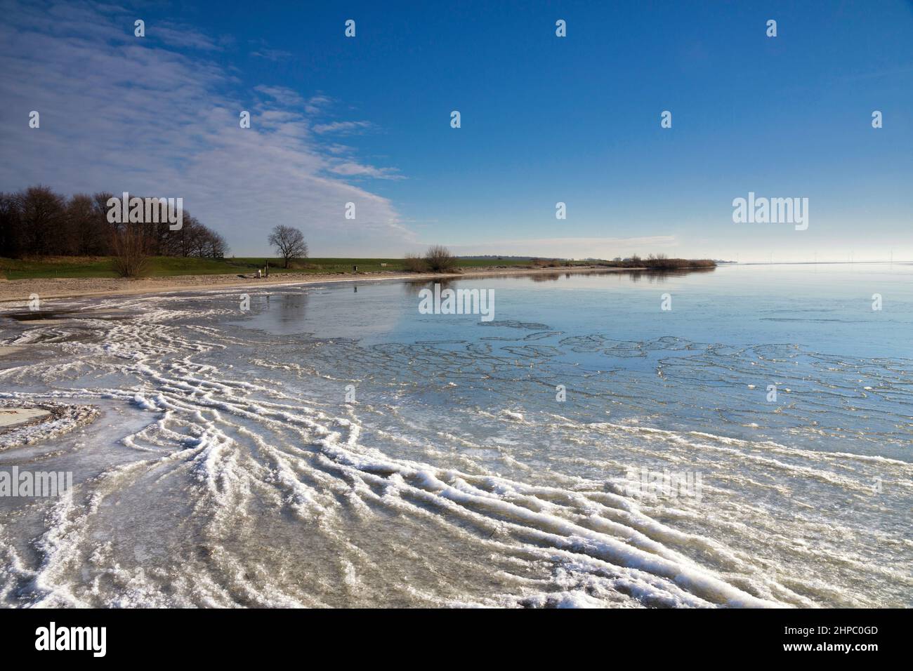 View over the frozen lake IJsselmeer from the Mirnser Cliff near Rijs in the Dutch province Friesland Stock Photo