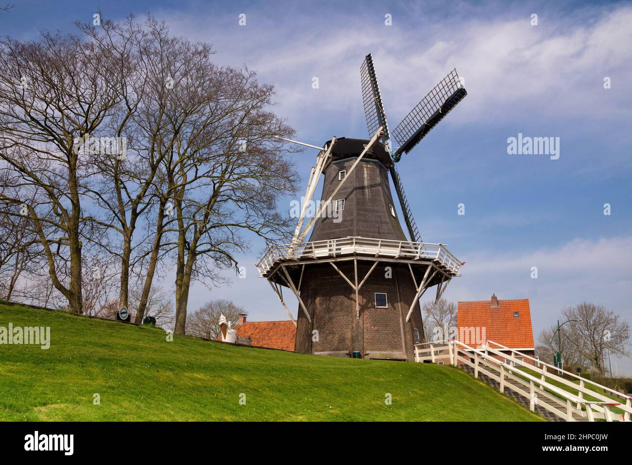 De Meeuw is a windmill on the bank of the Reitdiep river in the Dutch village Garnwerd in the province Groningen Stock Photo