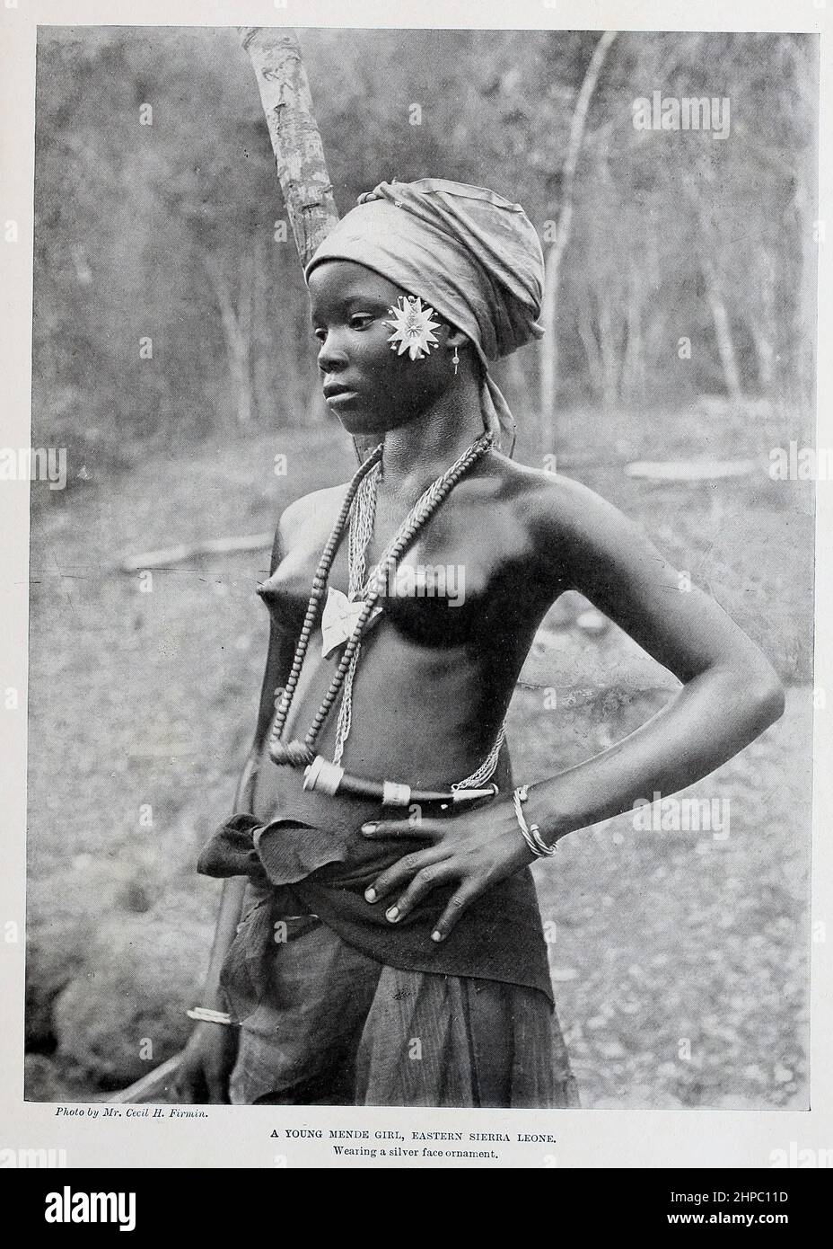 A Young Mende Girl, Eastern Sierra Leone Wearing a silver face ornament from the book ' The living races of mankind ' a popular illustrated account of the customs, habits, pursuits, feasts & ceremonies of the races of mankind throughout the world by Sir Harry Hamilton Johnston, and Henry Neville Hutchinson Published in London by Hutchinson & Co. in 1902 Stock Photo