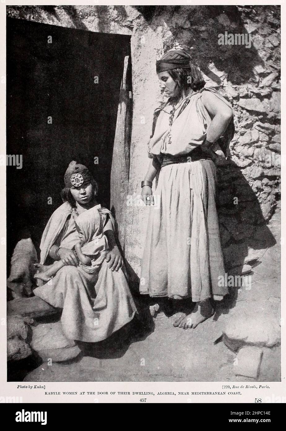 Kabyle Women at the door of their Dwelling, Algeria, Near the Mediterranean Coast  from the book ' The living races of mankind ' a popular illustrated account of the customs, habits, pursuits, feasts & ceremonies of the races of mankind throughout the world by Sir Harry Hamilton Johnston, and Henry Neville Hutchinson Published in London by Hutchinson & Co. in 1902 Stock Photo