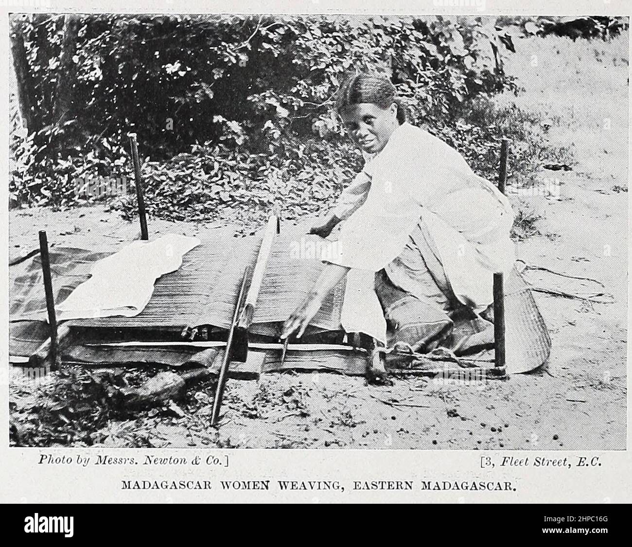 Madagascar Woman Weaving from the book ' The living races of mankind ' a popular illustrated account of the customs, habits, pursuits, feasts & ceremonies of the races of mankind throughout the world by Sir Harry Hamilton Johnston, and Henry Neville Hutchinson Published in London by Hutchinson & Co. in 1902 Stock Photo