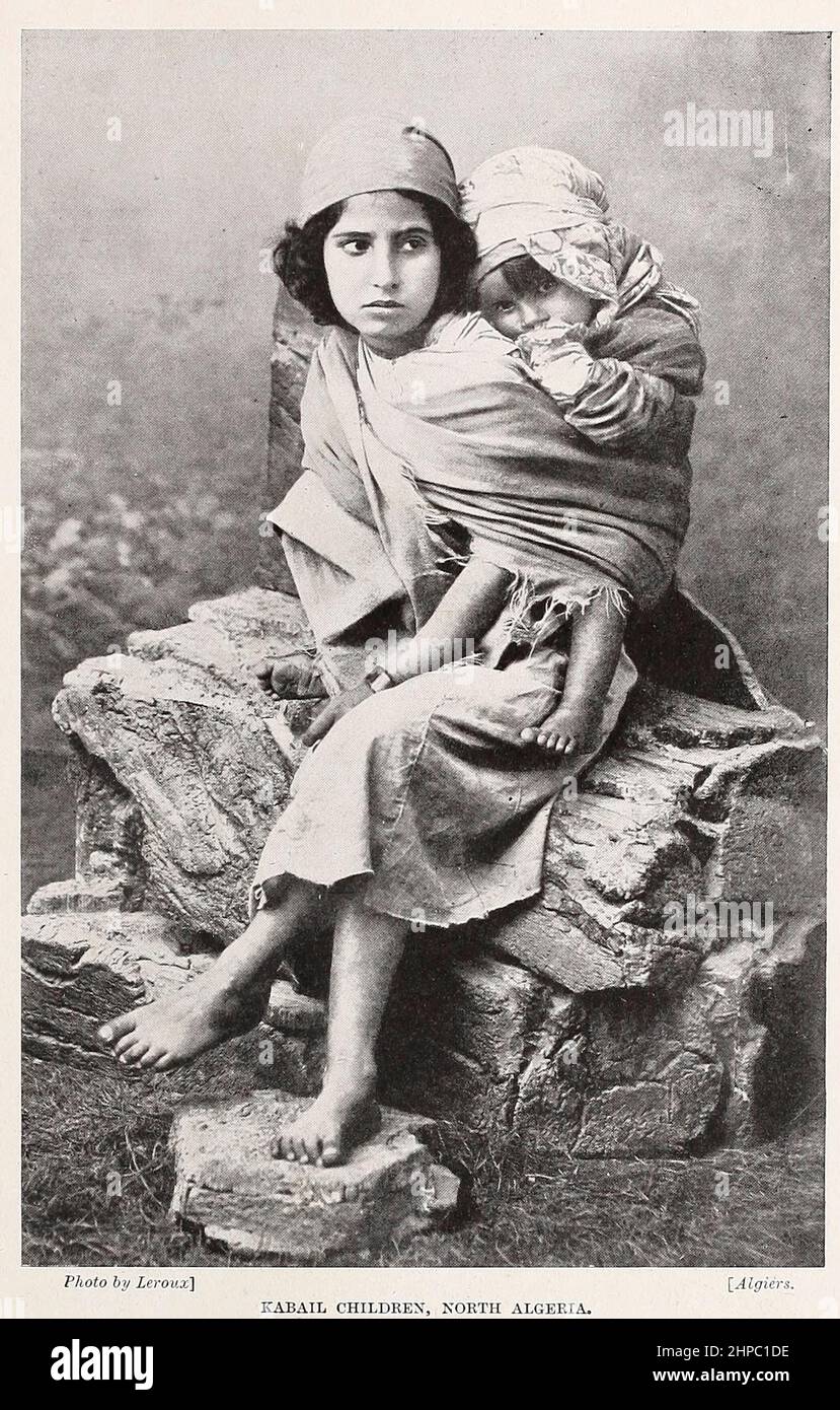 Kabyle children The Kabyle people are a Berber ethnic group indigenous to Kabylia in the north of Algeria, spread across the Atlas Mountains, one hundred miles east of Algiers. They represent the largest Berber-speaking population of Algeria and the second largest in North Africa. from the book ' The living races of mankind ' a popular illustrated account of the customs, habits, pursuits, feasts & ceremonies of the races of mankind throughout the world by Sir Harry Hamilton Johnston, and Henry Neville Hutchinson Published in London by Hutchinson & Co. in 1902 Stock Photo