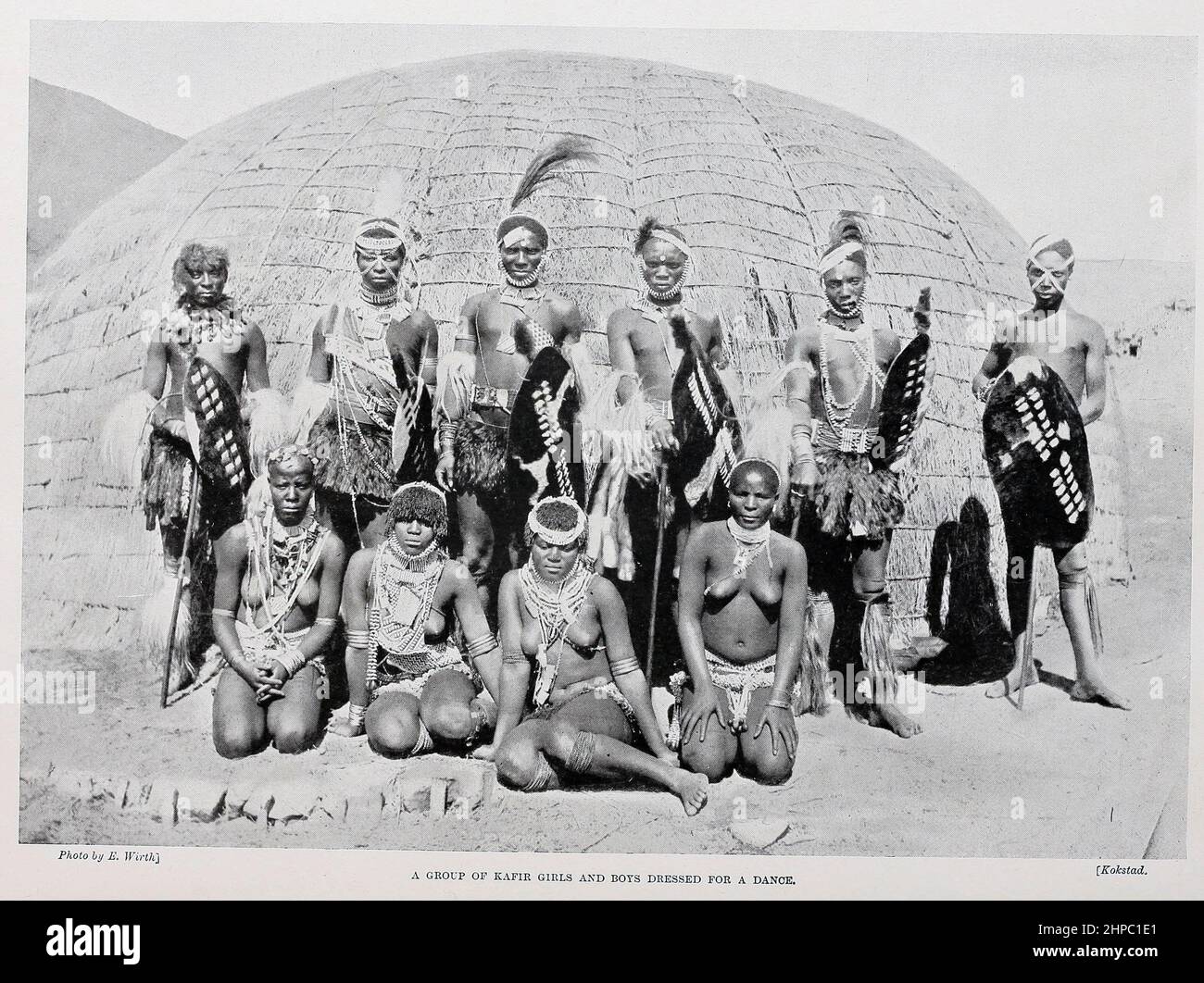 A Group of Kafir Boys and Girls dressed for a dance from the book ' The living races of mankind ' a popular illustrated account of the customs, habits, pursuits, feasts & ceremonies of the races of mankind throughout the world by Sir Harry Hamilton Johnston, and Henry Neville Hutchinson Published in London by Hutchinson & Co. in 1902 Stock Photo