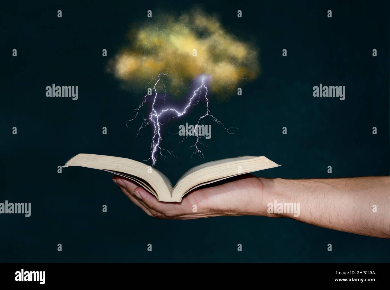 Man holding magic book with hand Stock Photo