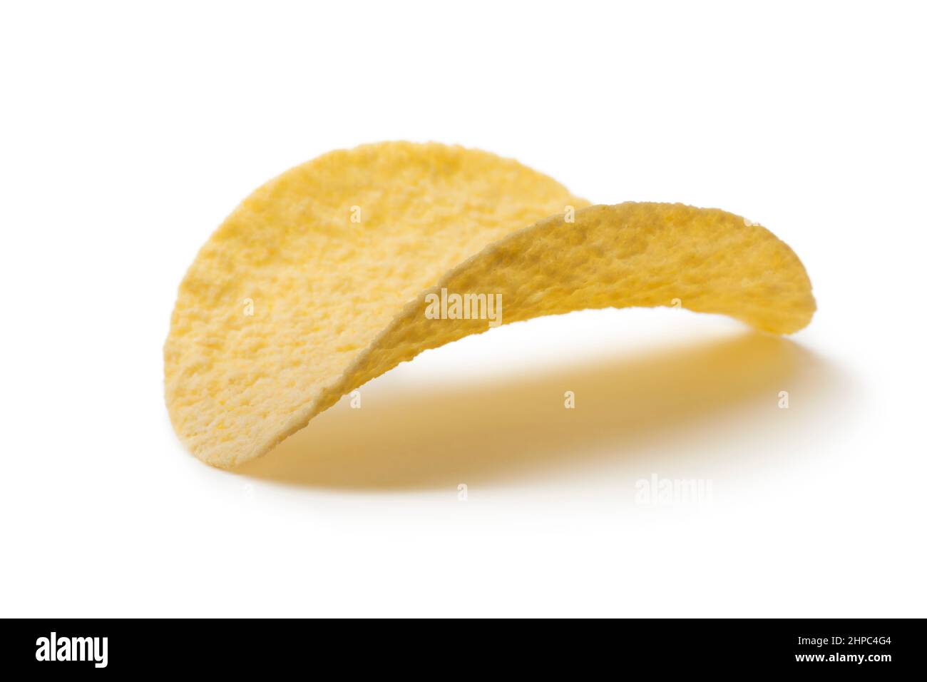 Single deep fried potato chip close up isolated on white background Stock Photo