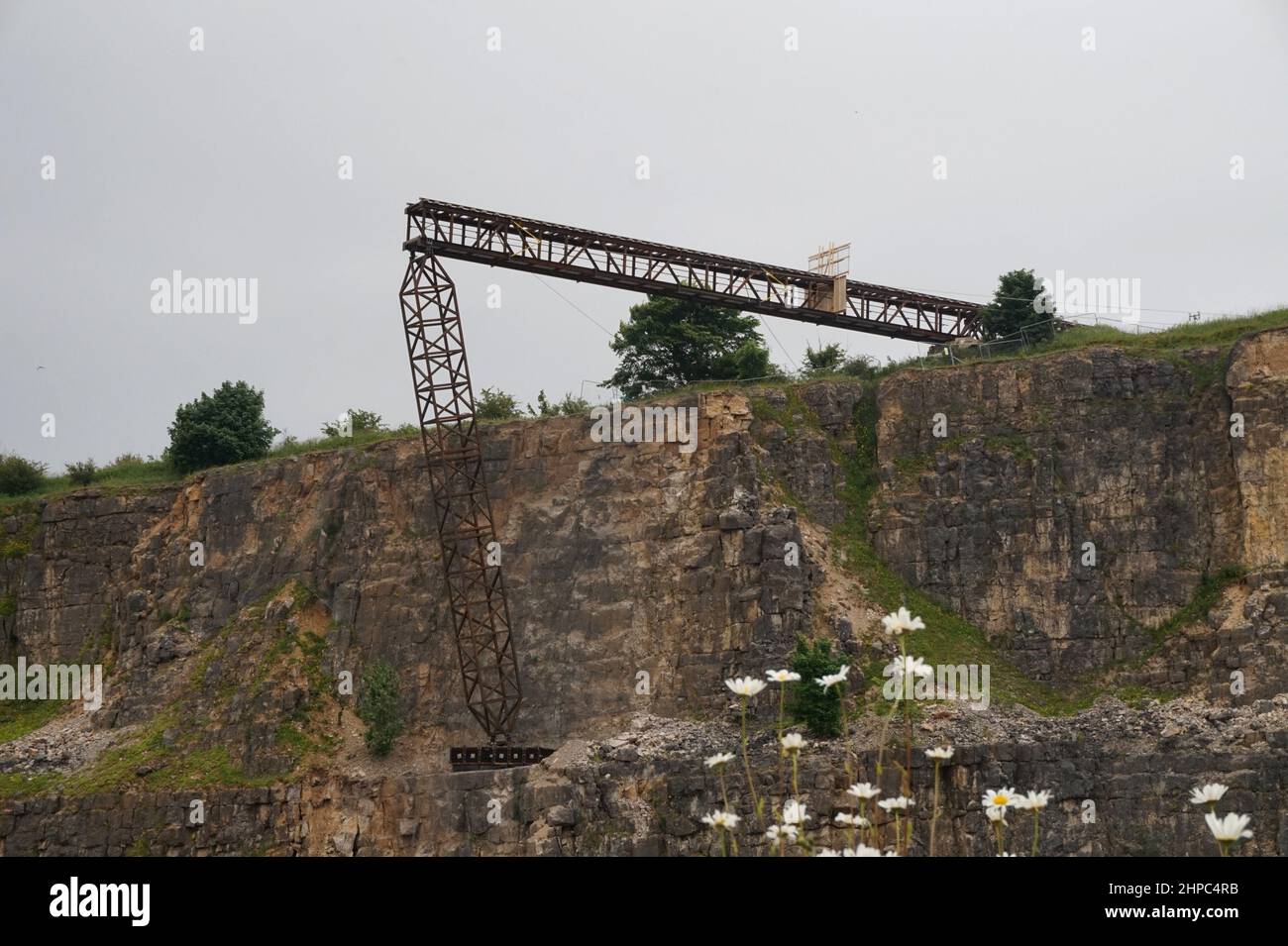 A fake railway bridge built over a disused quarry in the Peak District, UK, for a stunt involving a train crash for the film Mission Impossible 7. Stock Photo